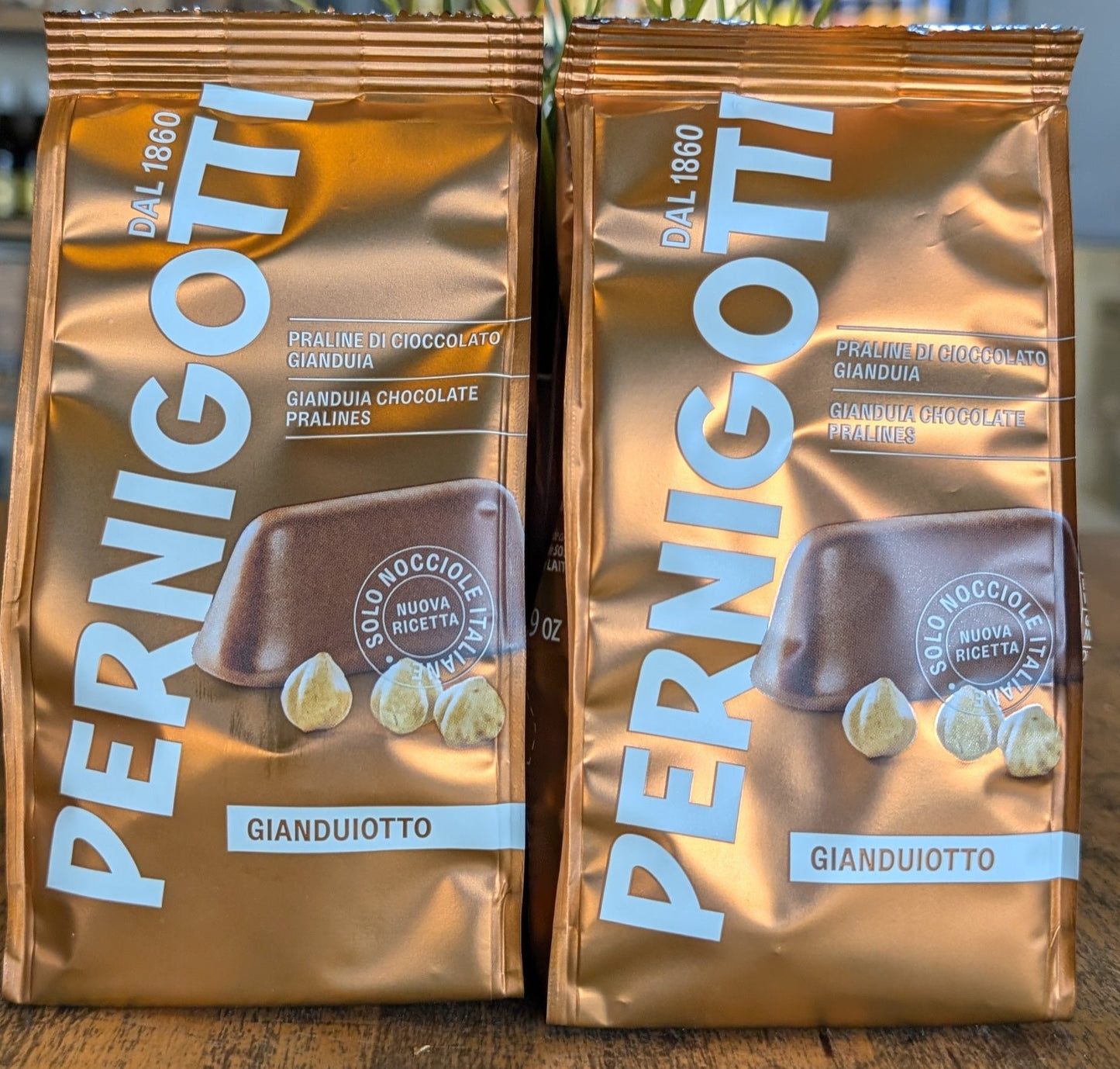 Pernigotti gianduiotti this iconic piemontese hazelnut praline chocolate in a shape of a upsidown boat it was originally cut by hand